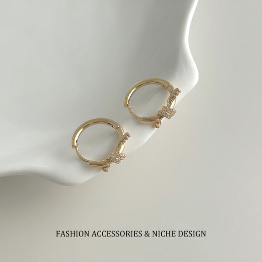 Pave CZ Knot Huggie Hoop Earrings